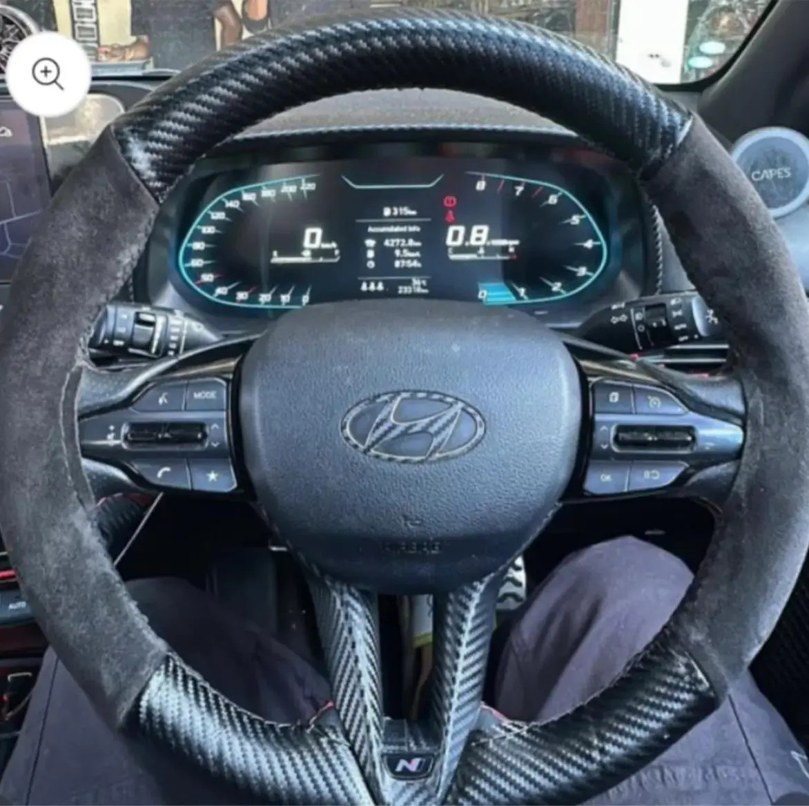 Carbon fibre steering wheel cover with alcantara