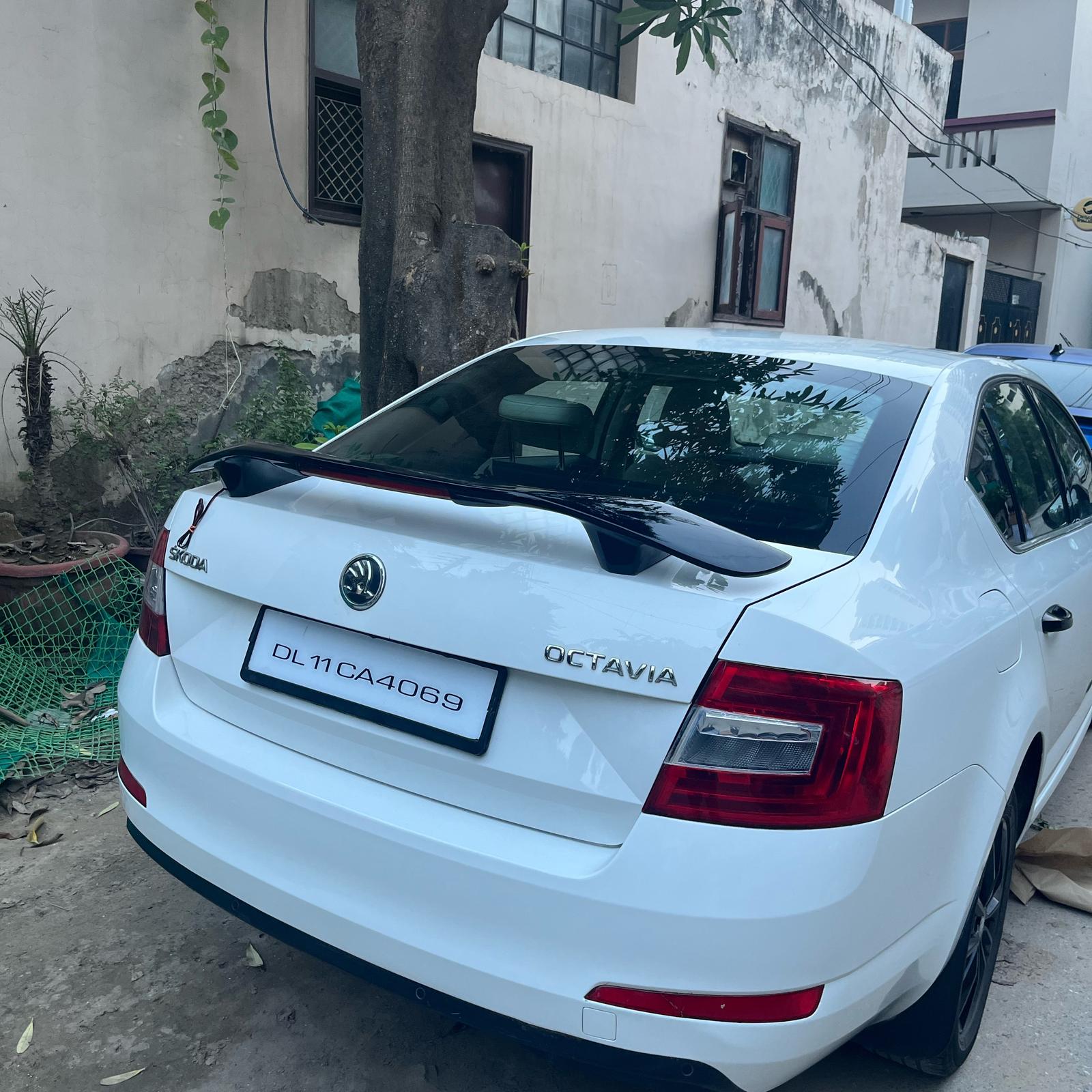 Universal sedan spoiler available with light in between in 100% ABS quality