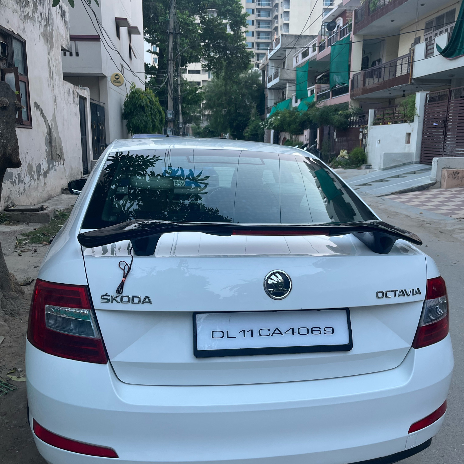 Universal sedan spoiler available with light in between in 100% ABS quality
